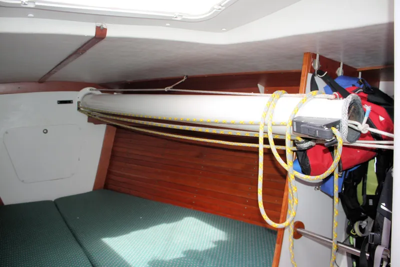 Lola Yacht Photos Pics Interior of 1995 J Boats J/130 sailboat with ropes and storage area.