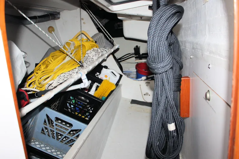 Lola Yacht Photos Pics Storage area in a 1995 J Boats J/130, featuring ropes and sailing equipment.
