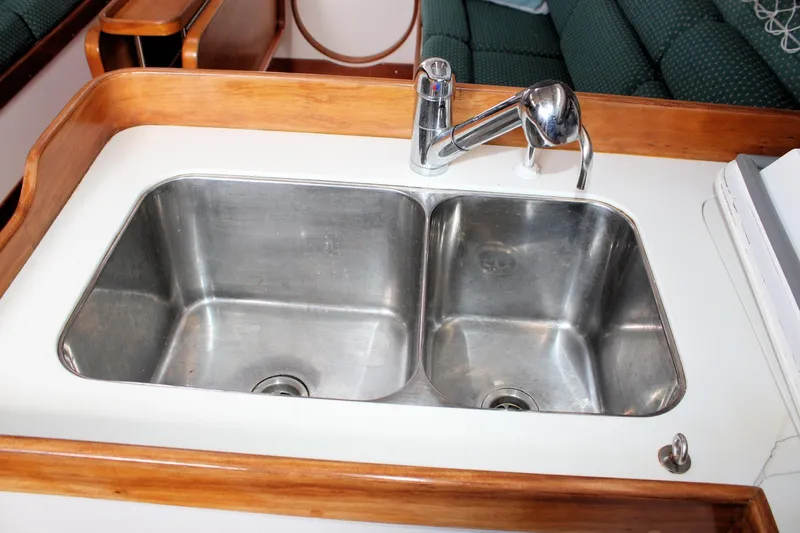 Lola Yacht Photos Pics Stainless steel double sink in 1995 J Boats J/130 yacht galley.