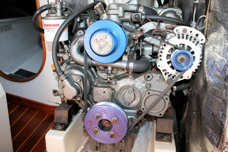 Lola Yacht Photos Pics Engine of a 1995 J Boats J/130 sailboat with visible Yanmar components.