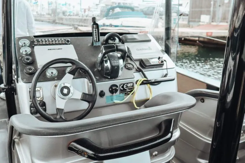  Yacht Photos Pics Cockpit of 2008 Fabio Buzzi FB 38 boat with steering wheel and control panel.