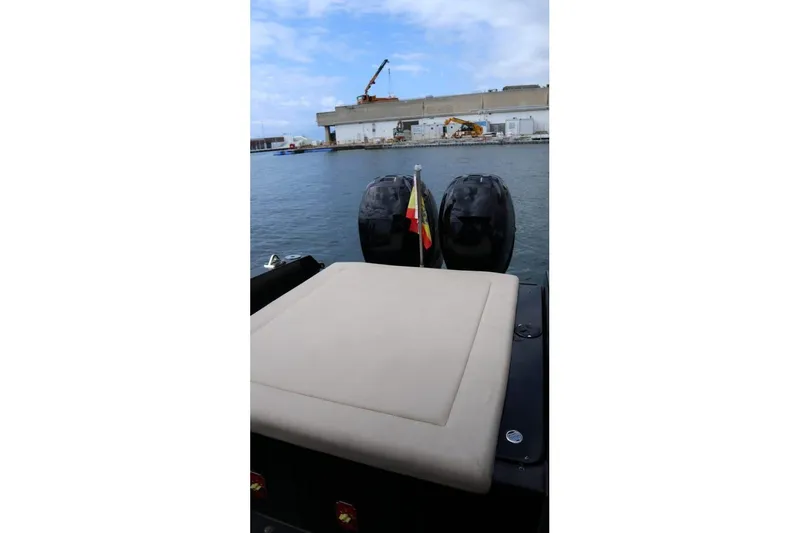  Yacht Photos Pics 2008 Fabio Buzzi FB 38 boat with dual engines, docked near industrial waterfront.