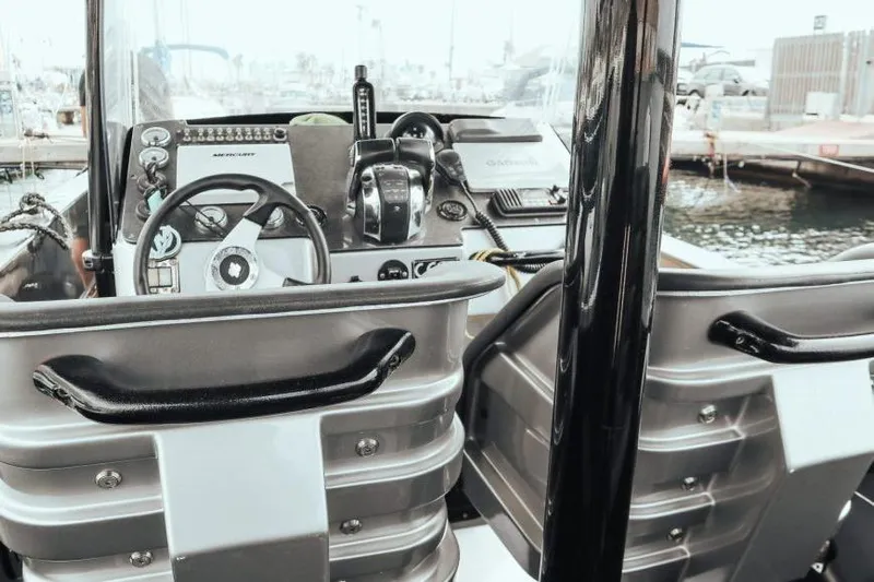  Yacht Photos Pics Interior view of 2008 Fabio Buzzi FB 38 boat cockpit with steering wheel and controls.