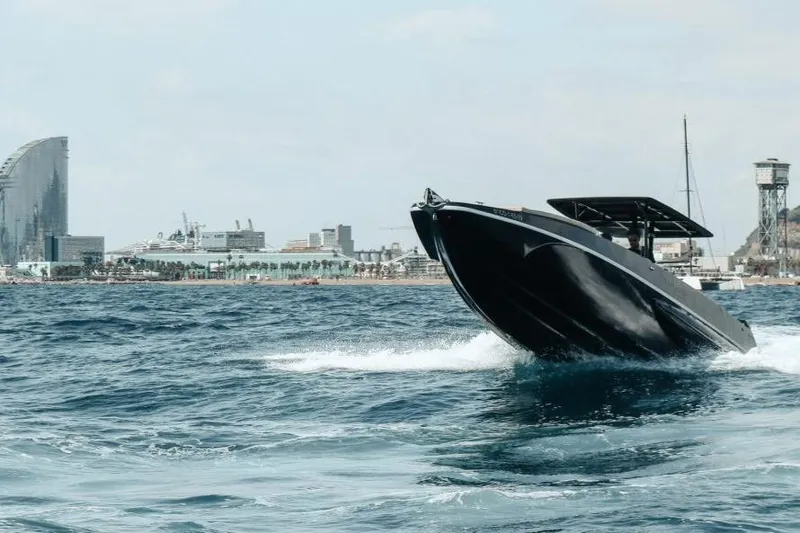  Yacht Photos Pics Fabio Buzzi FB 38 speedboat cruising near city skyline, 2008 model.