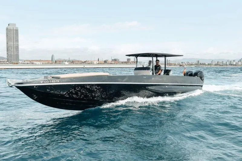  Yacht Photos Pics 2008 Fabio Buzzi FB 38 boat cruising on open water near city skyline.