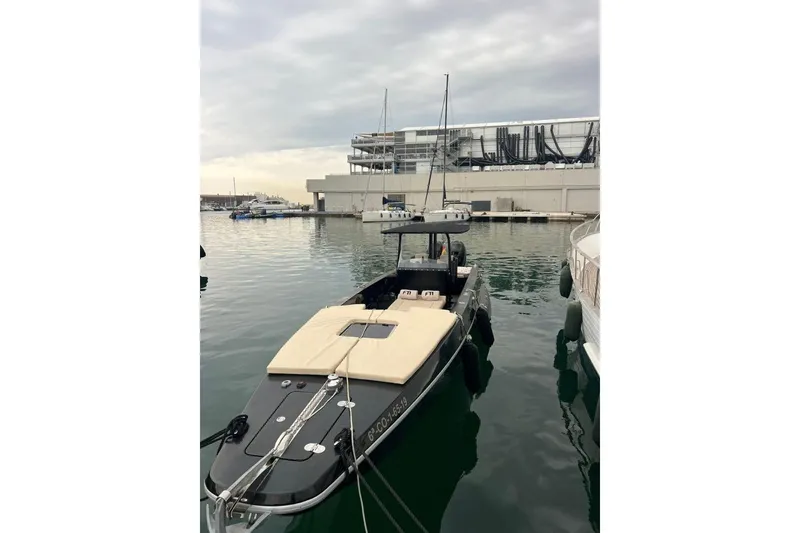  Yacht Photos Pics 2008 Fabio Buzzi FB 38 boat docked in a marina under cloudy skies.