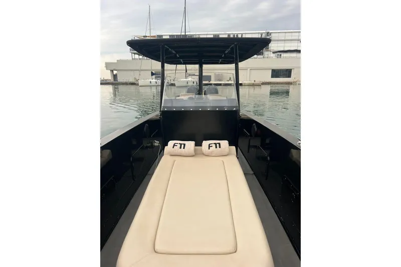  Yacht Photos Pics 2008 Fabio Buzzi FB 38 boat with beige seating, docked in a marina.