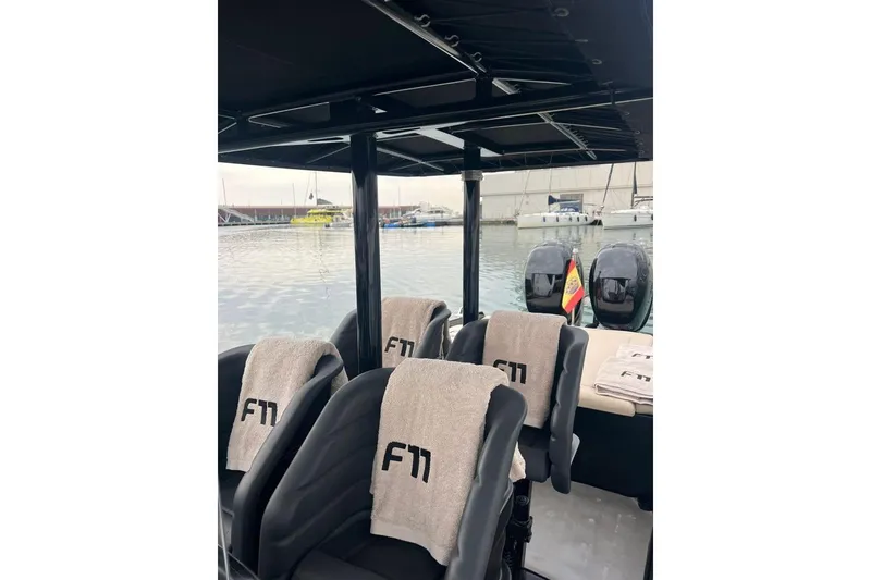  Yacht Photos Pics Interior of 2008 Fabio Buzzi FB 38 boat with F11-branded seats and waterfront view.