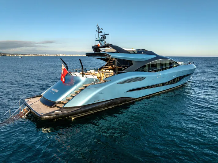 Delfina Yacht Photos Pics 2024 Mangusta 104 REV yacht on open sea, showcasing sleek design and luxury features.