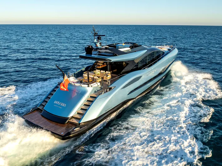 Delfina Yacht Photos Pics 2024 Mangusta 104 REV yacht cruising on open sea, showcasing sleek design and luxury features.