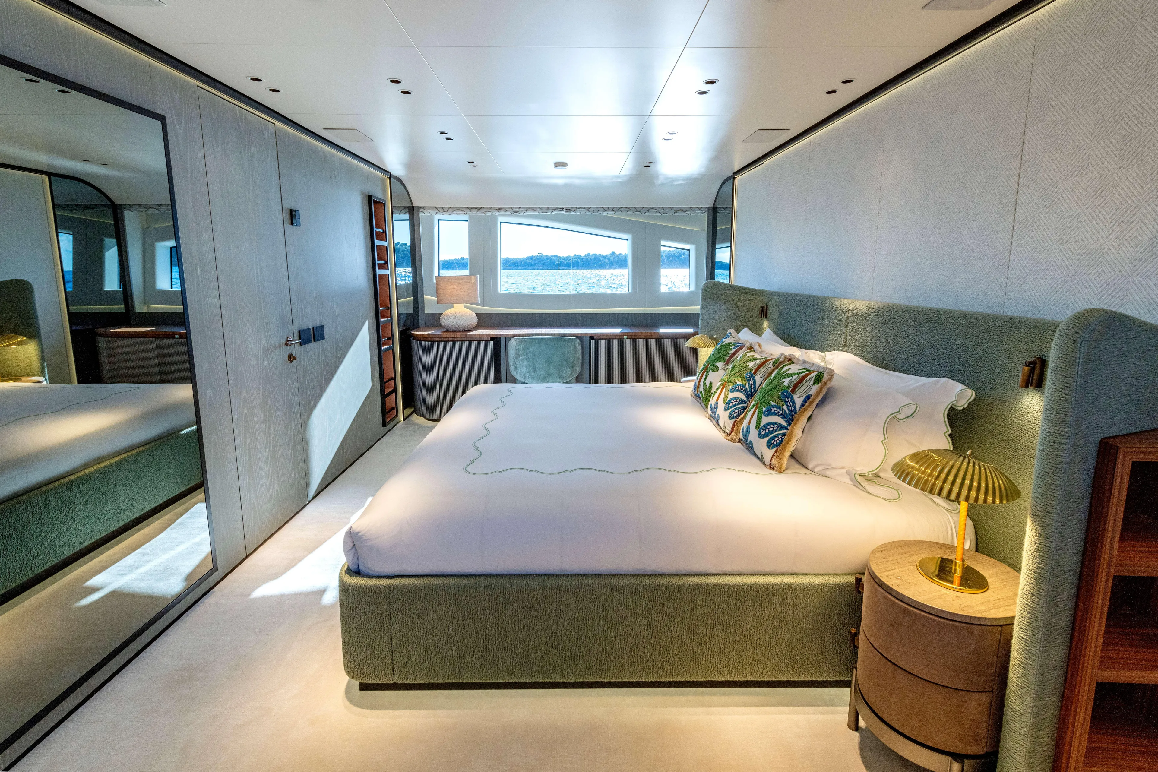 Delfina Yacht Photos Pics Luxurious bedroom interior of 2024 Mangusta 104 REV yacht with modern design and ocean view.