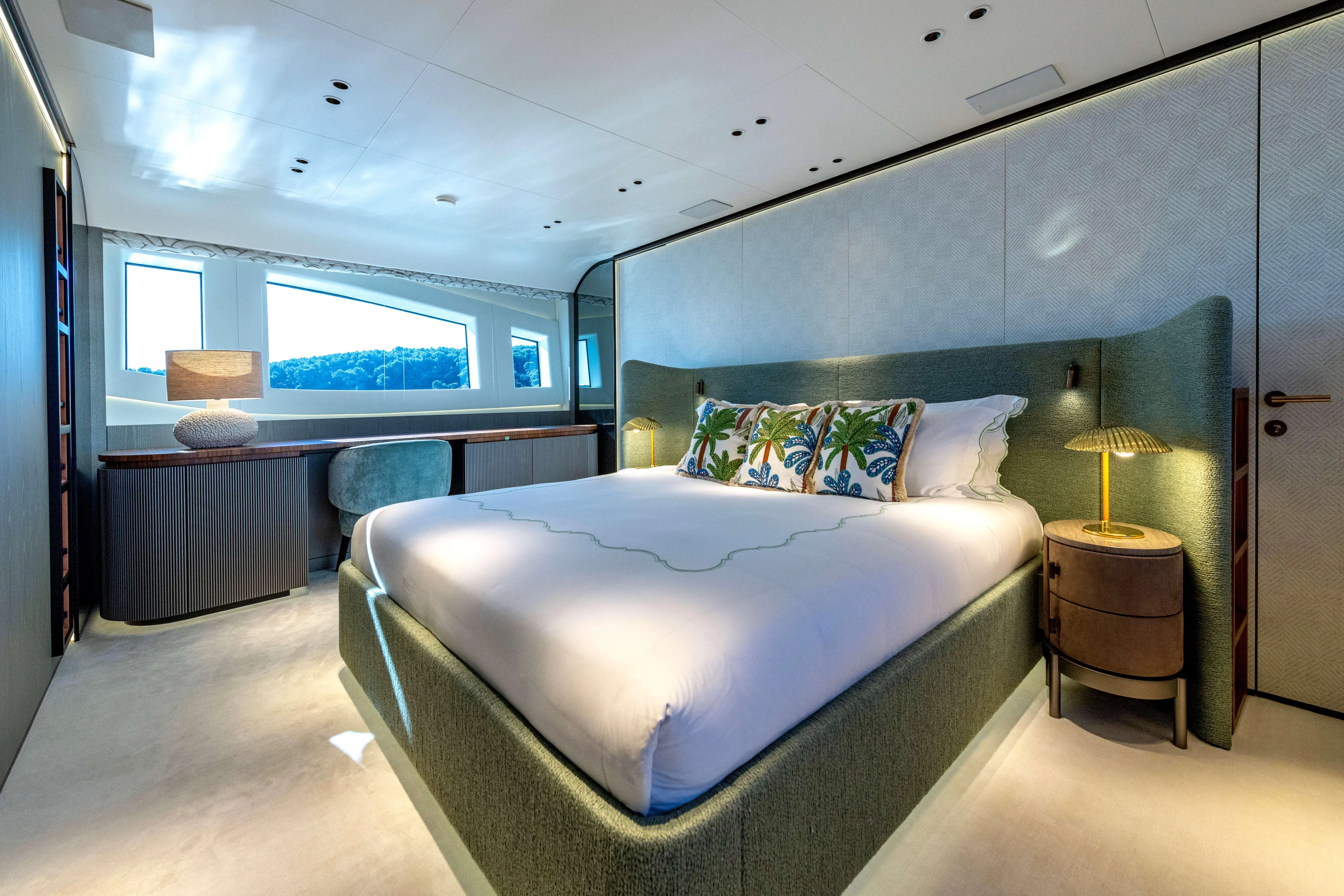 Delfina Yacht Photos Pics Luxurious bedroom interior of 2024 Mangusta 104 REV yacht with elegant decor and large windows.