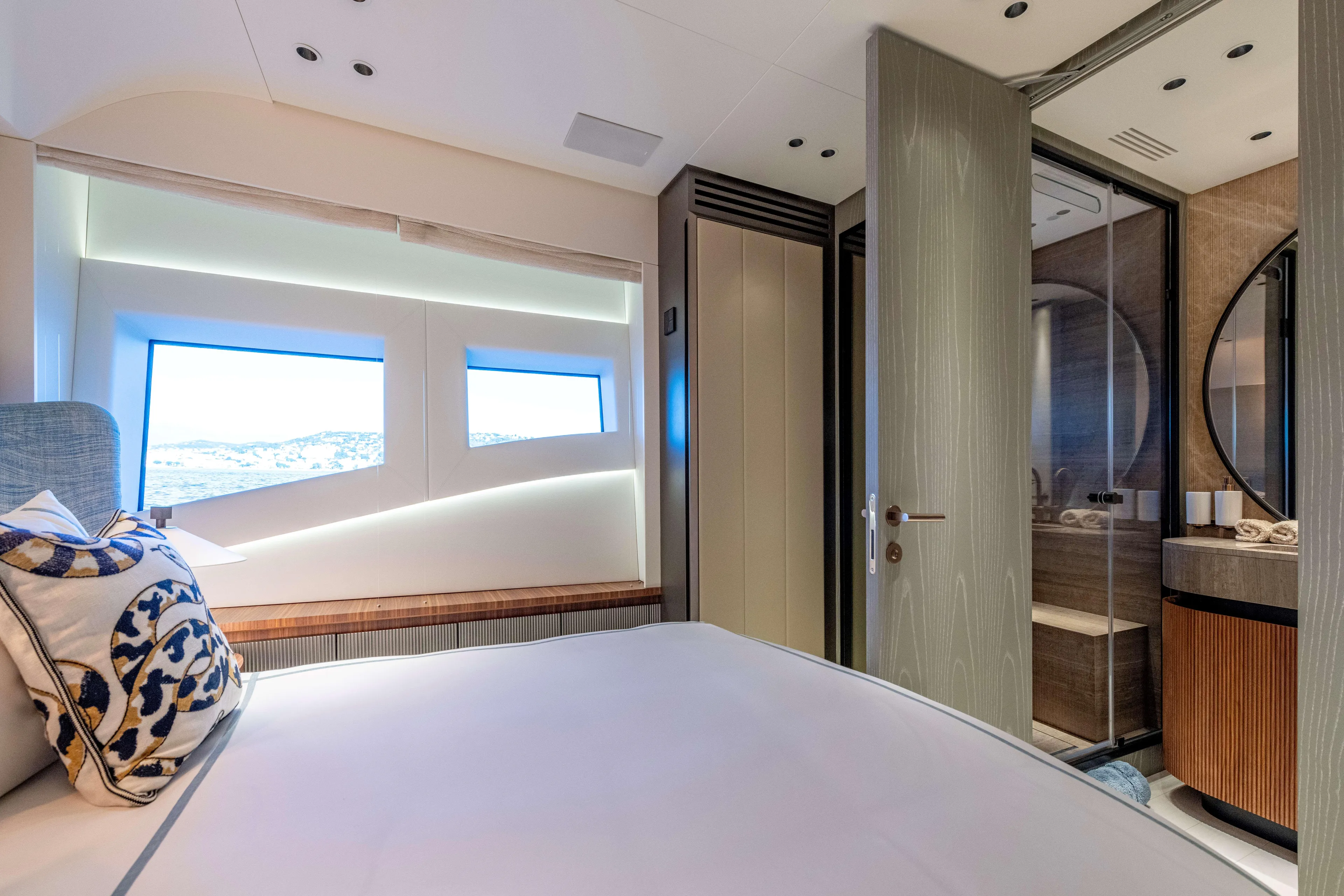 Delfina Yacht Photos Pics Luxurious interior of 2024 Mangusta 104 REV yacht cabin with modern design and elegant furnishings.