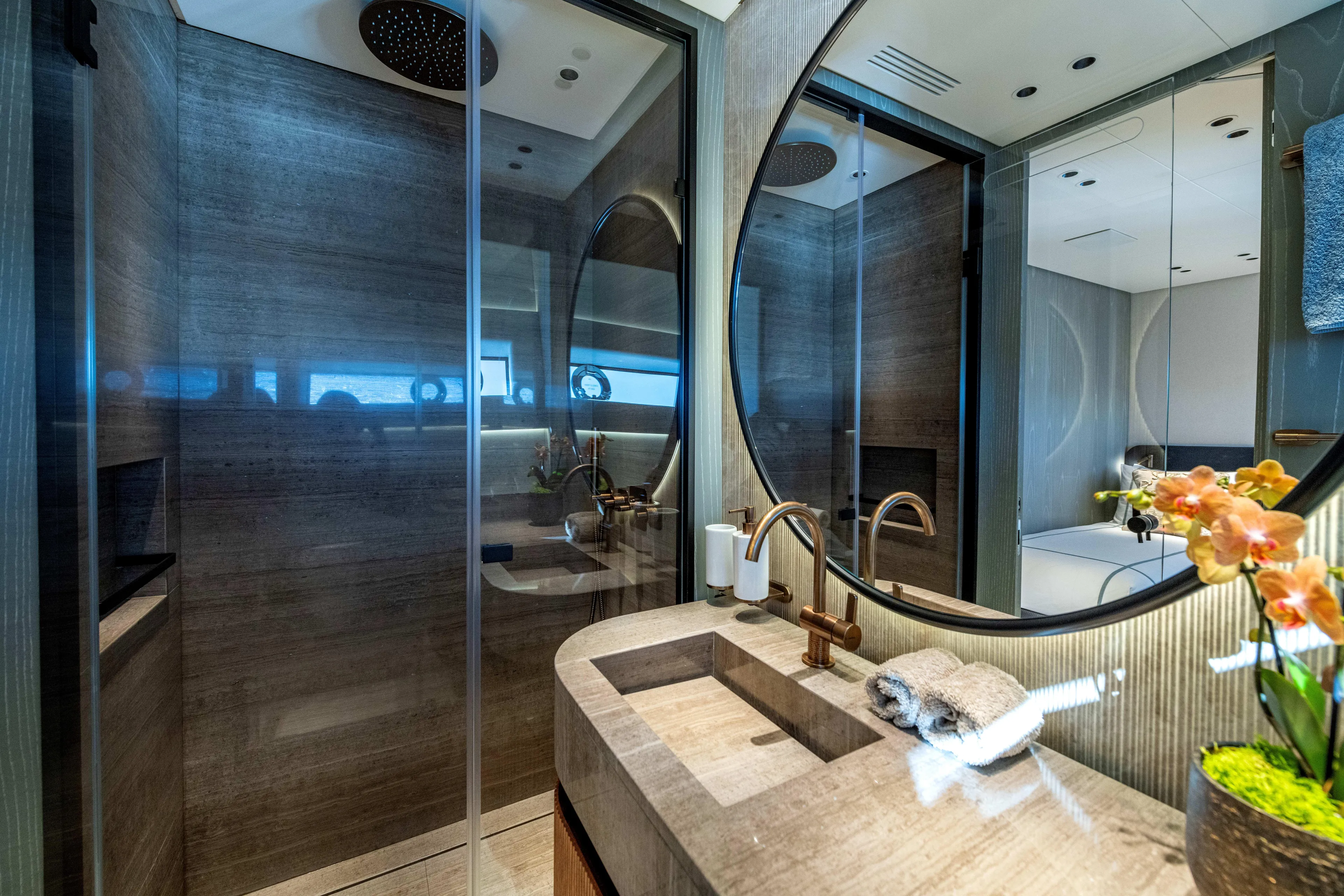 Delfina Yacht Photos Pics Luxurious bathroom in 2024 Mangusta 104 REV yacht with modern fixtures and elegant design.
