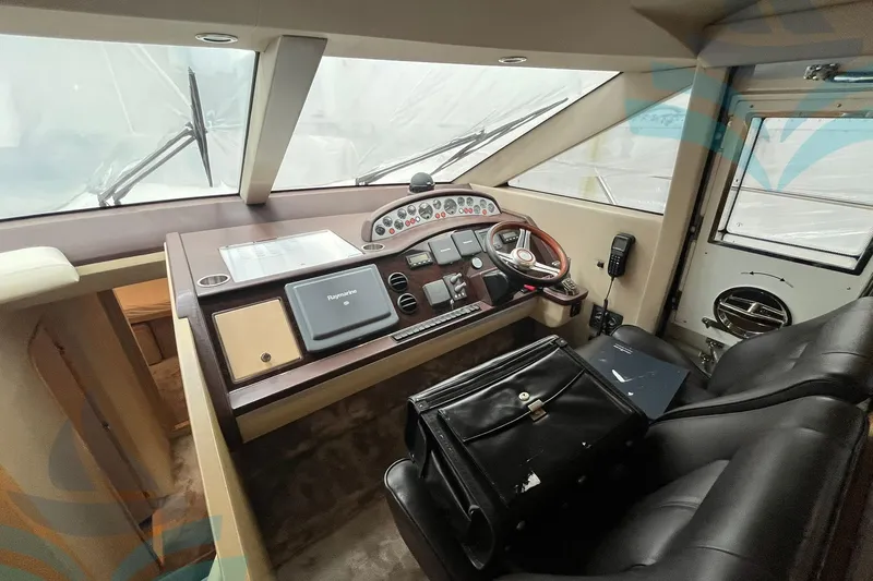  Yacht Photos Pics Helm of 2010 Princess 62 yacht with navigation equipment and leather seating.