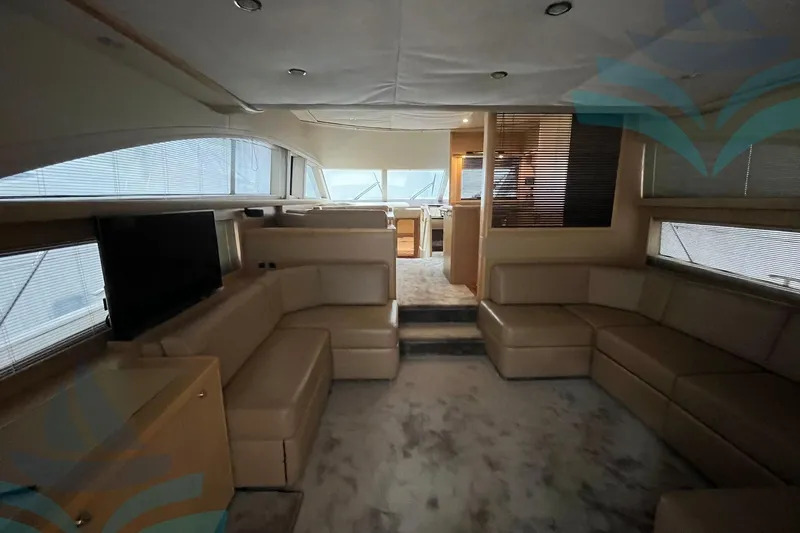  Yacht Photos Pics Luxurious interior of a 2010 Princess 62 yacht with beige leather seating.