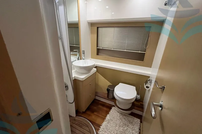  Yacht Photos Pics Luxurious bathroom in 2010 Princess 62 yacht with modern fixtures and elegant design.