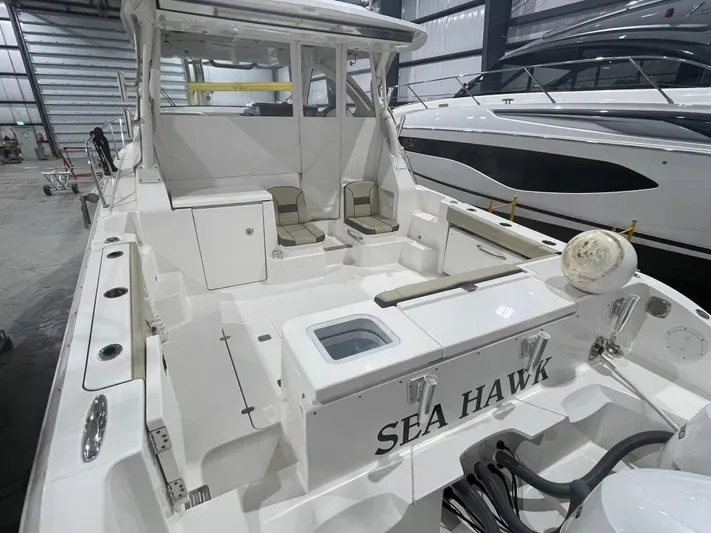 Sea Hawk Yacht Photos Pics 2020 Pursuit OS 355 Offshore boat named "Sea Hawk" in a storage facility.