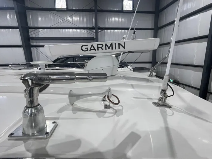 Sea Hawk Yacht Photos Pics 2020 Pursuit OS 355 Offshore boat with Garmin radar in a storage facility.