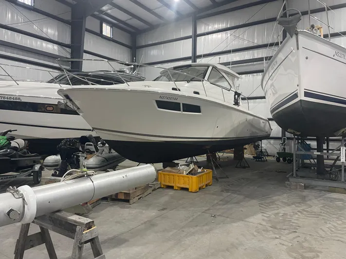 Sea Hawk Yacht Photos Pics 2020 Pursuit OS 355 Offshore boat in storage facility.