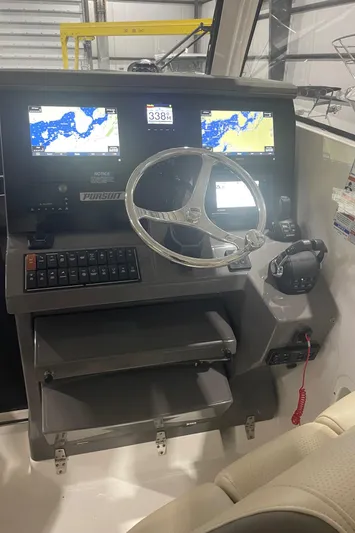 Sea Hawk Yacht Photos Pics 2020 Pursuit OS 355 Offshore helm with dual navigation screens and steering wheel.