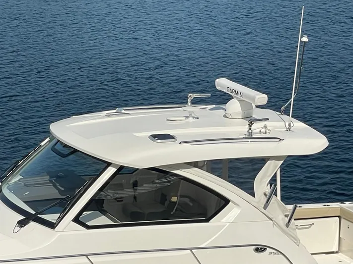 Sea Hawk Yacht Photos Pics 2020 Pursuit OS 355 Offshore boat with Garmin radar on calm water.
