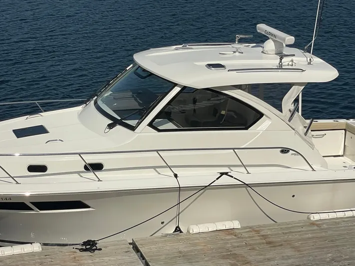 Sea Hawk Yacht Photos Pics 2020 Pursuit OS 355 Offshore boat docked on calm water.