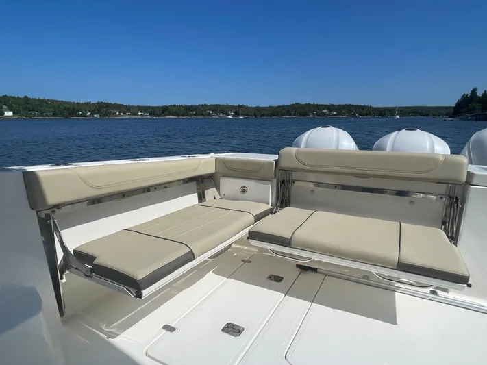 Sea Hawk Yacht Photos Pics 2020 Pursuit OS 355 Offshore boat seating area with scenic water view.