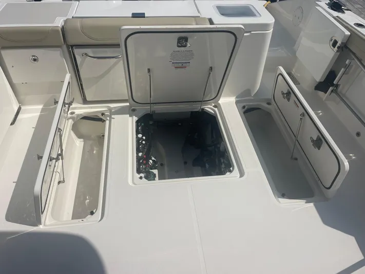 Sea Hawk Yacht Photos Pics 2020 Pursuit OS 355 Offshore boat deck with open storage compartments.