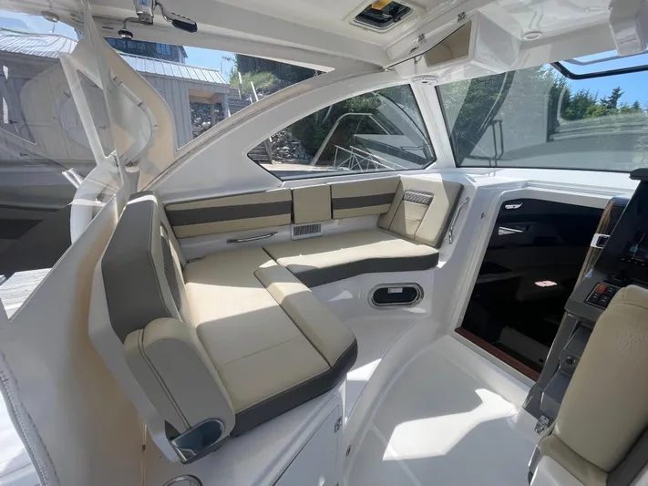 Sea Hawk Yacht Photos Pics Interior of 2020 Pursuit OS 355 Offshore boat, featuring sleek seating and modern design.