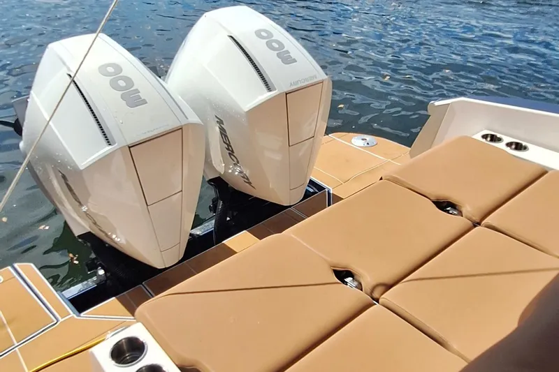  Yacht Photos Pics 2021 Aviara AV32 OB boat with twin Mercury outboard engines and tan seating.
