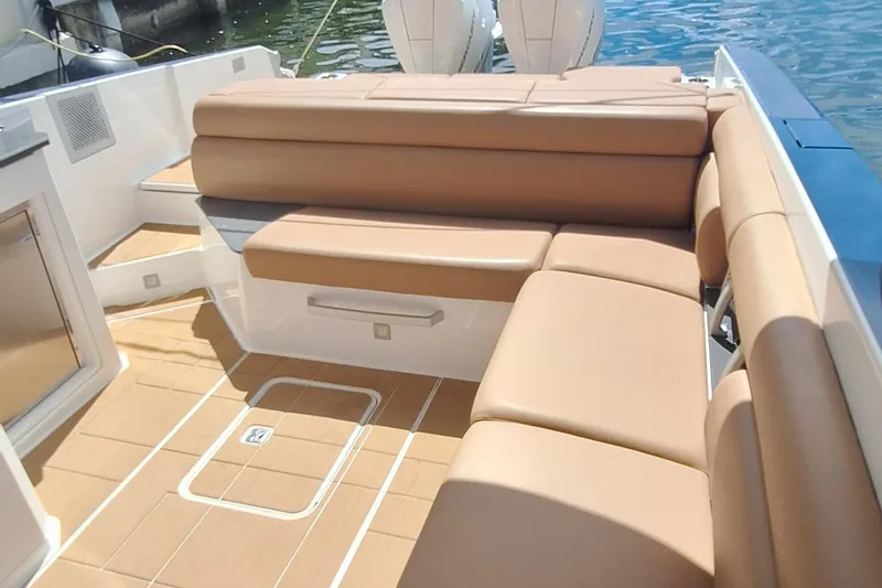  Yacht Photos Pics Luxurious seating on 2021 Aviara AV32 OB boat with tan upholstery and sleek design.