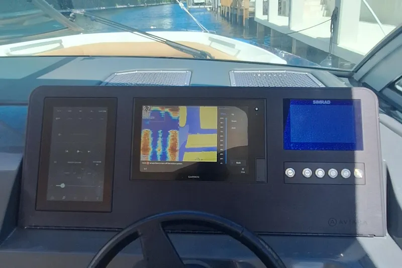  Yacht Photos Pics Dashboard of 2021 Aviara AV32 OB boat with navigation and control screens.