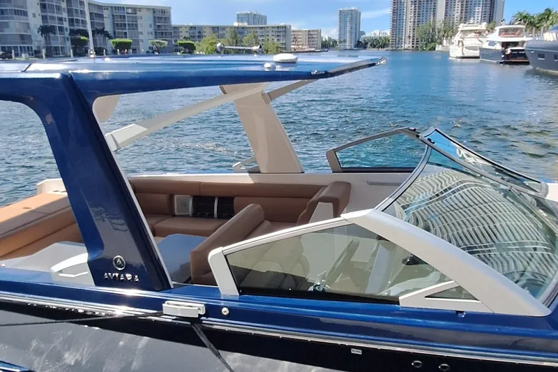  Yacht Photos Pics 2021 Aviara AV32 OB luxury boat docked in a scenic marina setting.