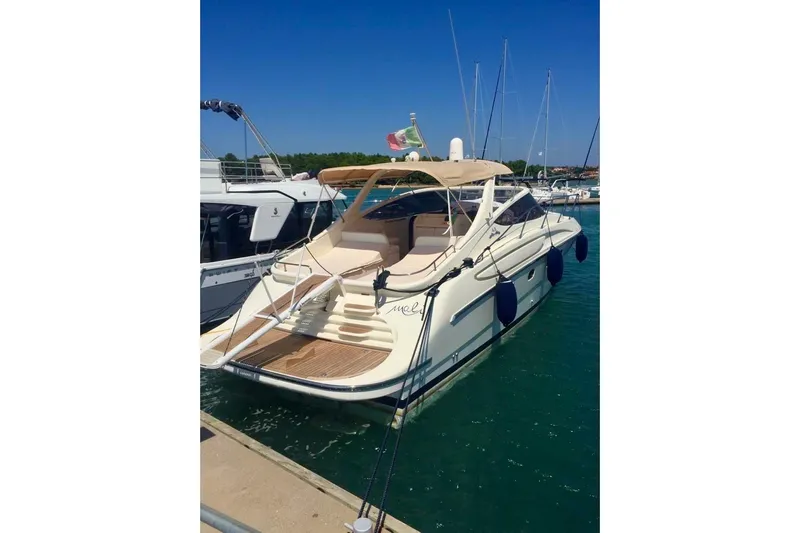  Yacht Photos Pics Luxury 2008 Cantieri di Sarnico 43 yacht docked in marina under clear blue sky.