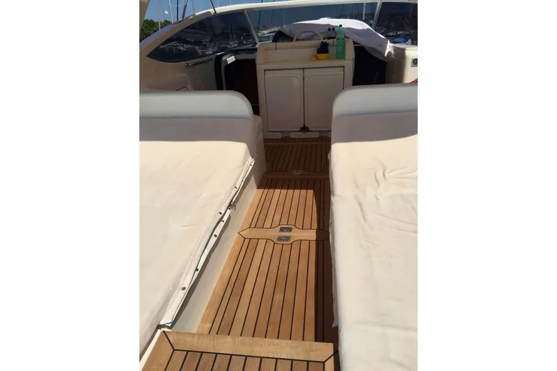  Yacht Photos Pics 2008 Cantieri di Sarnico 43 yacht interior with teak flooring and cushioned seating.