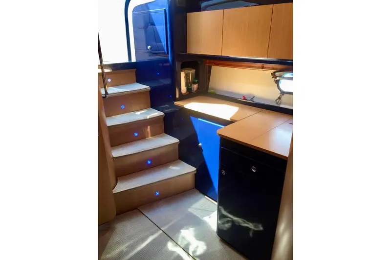  Yacht Photos Pics Interior of 2008 Cantieri di Sarnico 43 yacht with modern kitchen and illuminated stairs.