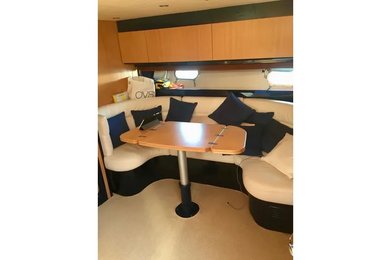  Yacht Photos Pics Luxurious interior of 2008 Cantieri di Sarnico 43 yacht with cozy seating and table.
