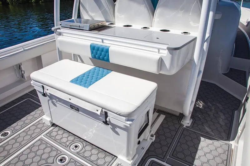  Yacht Photos Pics 2021 Belzona 32 Walkaround boat interior with cushioned seating and storage.