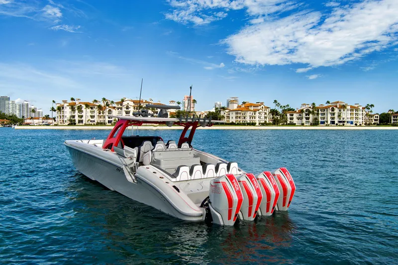  Yacht Photos Pics 2023 Midnight Express 43 Open boat with multiple engines on a sunny waterfront.