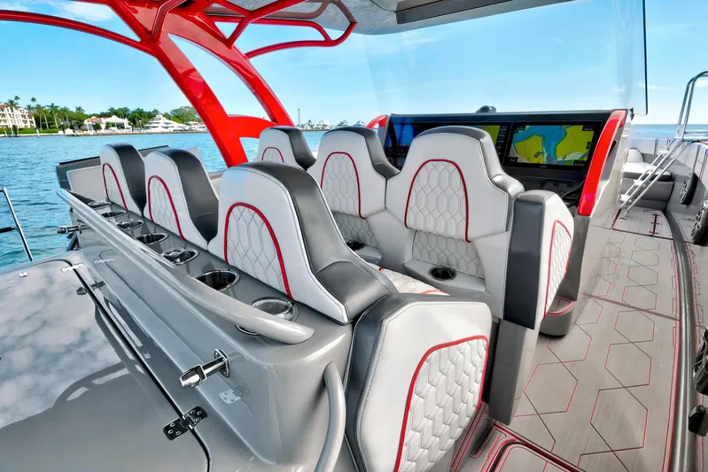  Yacht Photos Pics Luxurious interior of 2023 Midnight Express 43 Open boat with modern seating and navigation displays.