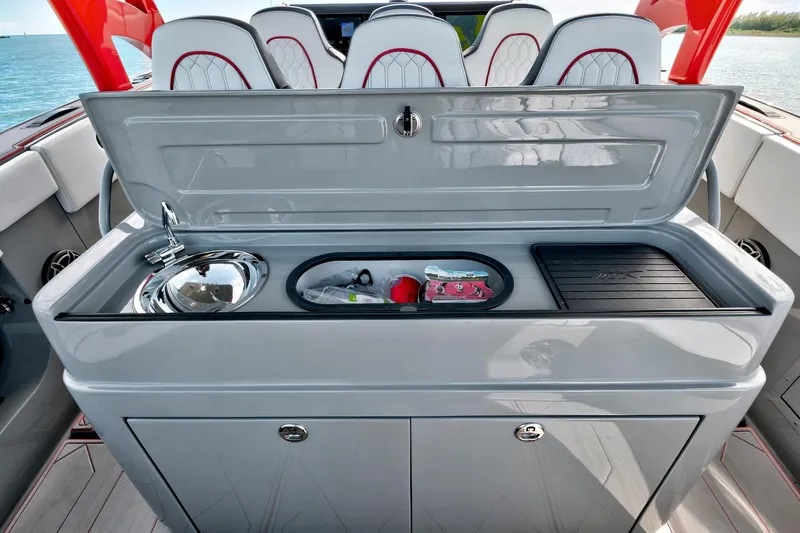  Yacht Photos Pics 2023 Midnight Express 43 Open boat interior with sleek kitchenette and seating.