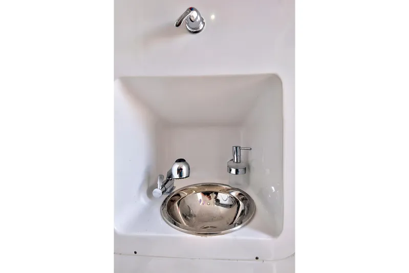  Yacht Photos Pics Compact sink with chrome fixtures in 2023 Midnight Express 43 Open boat.