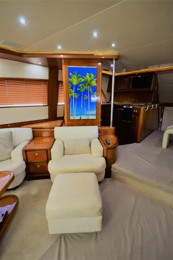 Gabby Millan 2 Yacht Photos Pics Luxurious interior of a 2003 Bertram 67 Convertible yacht with plush seating.