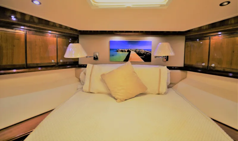 Gabby Millan 2 Yacht Photos Pics Luxurious bedroom interior of 2003 Bertram 67 Convertible yacht.
