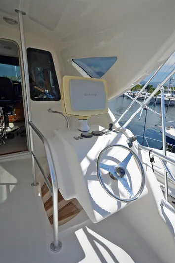 Gabby Millan 2 Yacht Photos Pics 2003 Bertram 67 Convertible yacht helm station with navigation equipment.