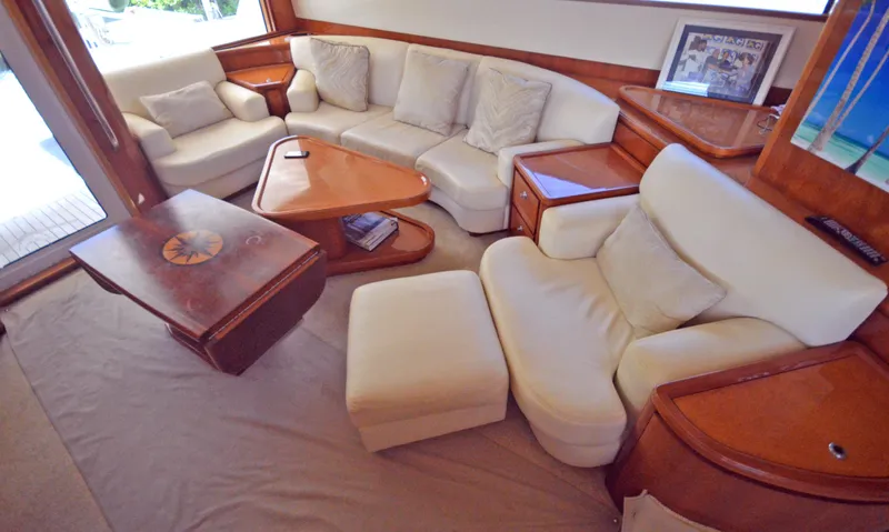 Gabby Millan 2 Yacht Photos Pics Luxurious interior of a 2003 Bertram 67 Convertible yacht with cream leather seating.