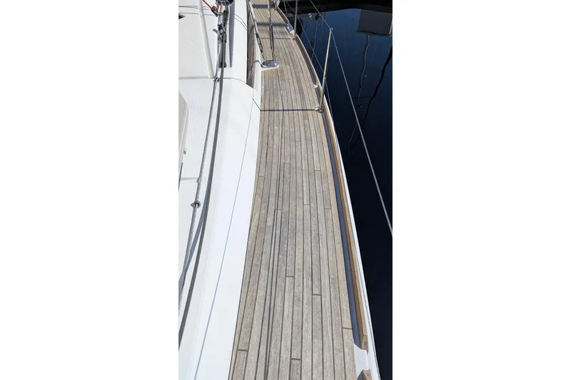 Falcor Yacht Photos Pics Teak deck of 2013 Jeanneau Sun Odyssey 44 DS sailboat, showcasing elegant design.