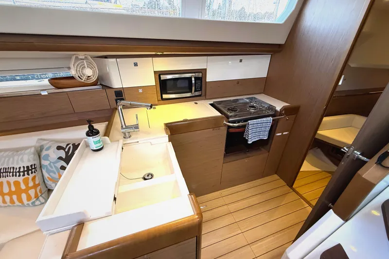 Falcor Yacht Photos Pics Interior of 2013 Jeanneau Sun Odyssey 44 DS yacht kitchen with modern amenities.
