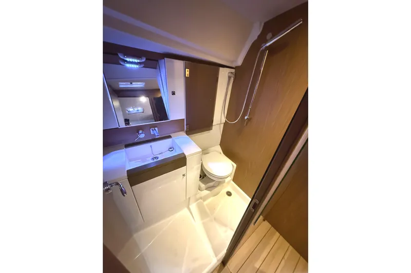 Falcor Yacht Photos Pics Luxurious bathroom in 2013 Jeanneau Sun Odyssey 44 DS yacht with modern fixtures.
